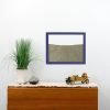 purple painted wood frame ant farm hanging on wall