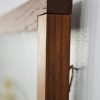 walnut natural wood frame ant farm hanging on wall close up